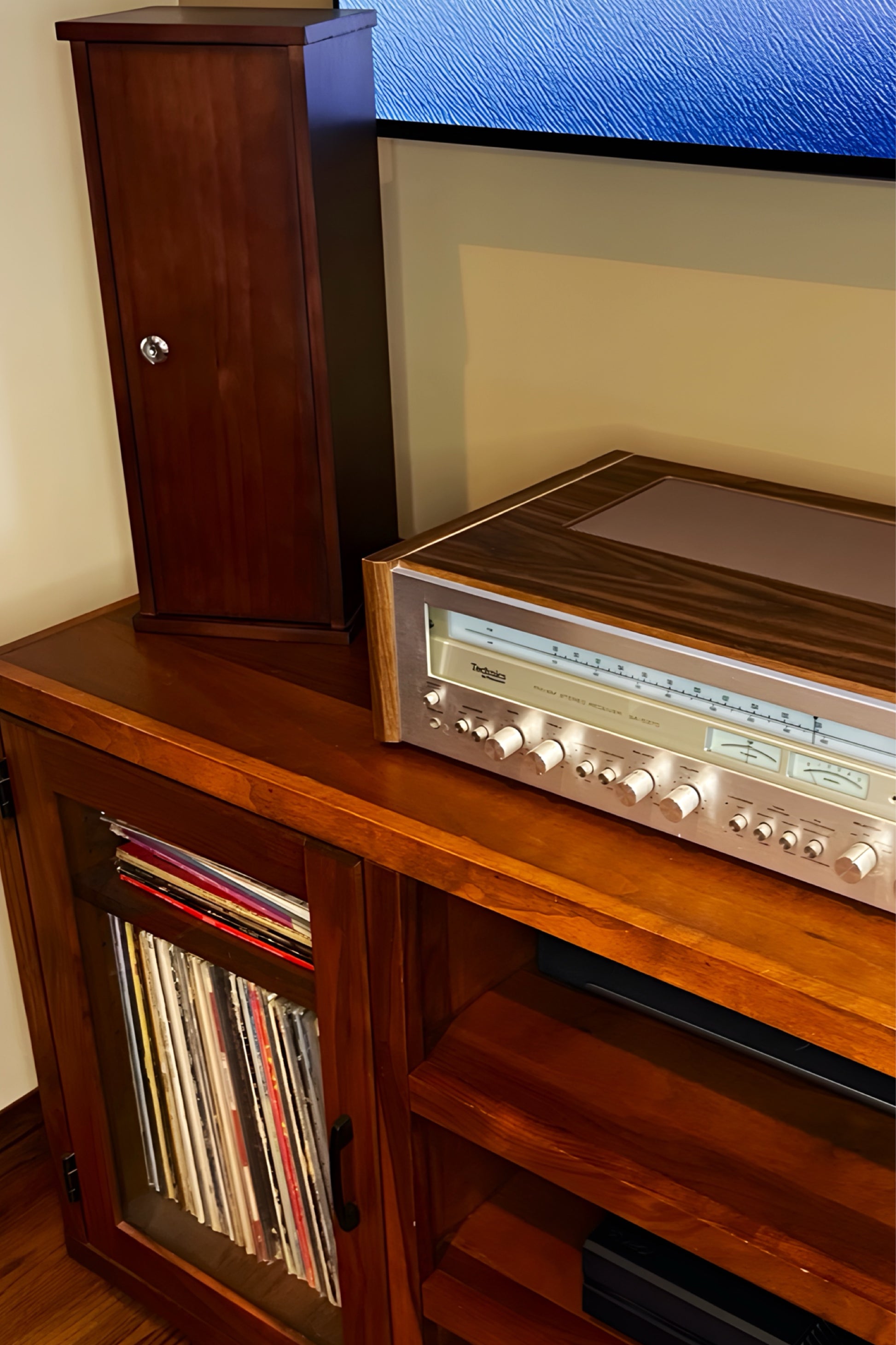 Stash Box + Vintage radio on a wooden shelf with records underneath